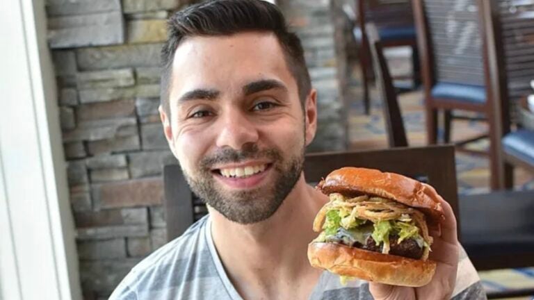 Joey Calcavecchia with a burger